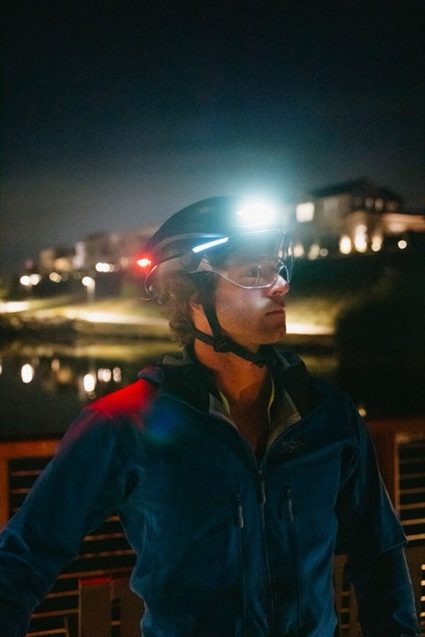 Rider at night with the Lumos helmet front light on