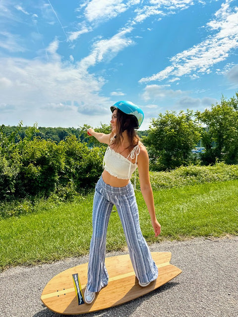 Woman in a helmet riding a skateboard